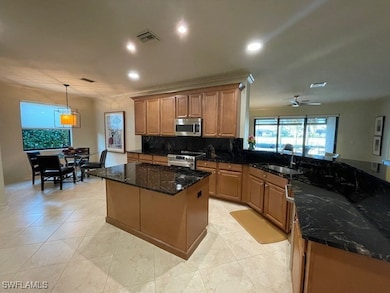 Kitchen featuring stainless steel appliances, ceil