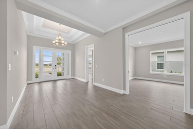 Stunning foyer at the front and den / office as you walk further into the home.