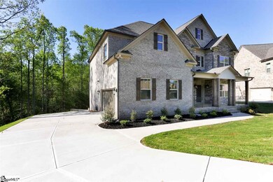With stamped and stained concrete accent at end of