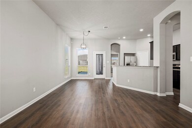 Unfurnished living room with dark hardwood / wood-
