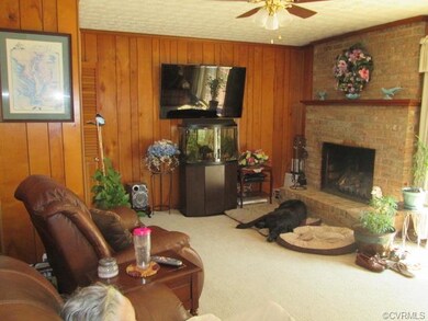 Family room off the kitchen has door to deck