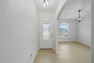 Entryway with dining or office to the right.