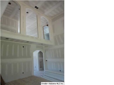 Great Room with Raised Ceilings and Arched Cat Wal
