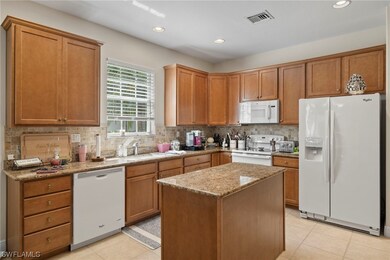 12811 Carrington Cir unit 1-102, Naples, FL 34105 - photo 7