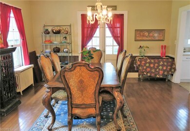 The formal dining room features beautiful hardwood