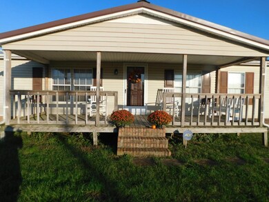 Covered front porch and back!  Ready for your rocking chair