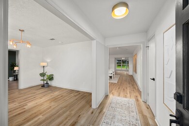 View of the formal living and dining room as you e
