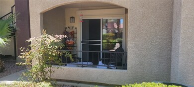 Property entrance with stucco siding