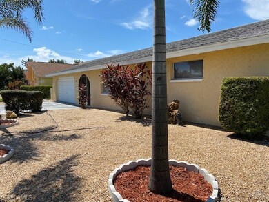 Two car garage, covered entry and low maintenance