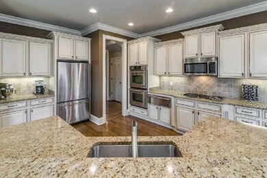 The Kitchen - attention to detail!  Appliances include a Jenn-Air 5 burner cook top and double oven, accented by the beautifully glazed cabinets andcoordinating granite countertops.