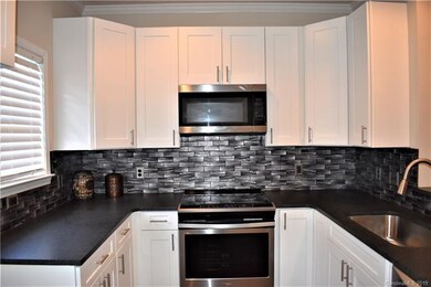 Shaker cabinets with granite counter tops