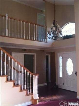 Dramatic staircase in the entry.