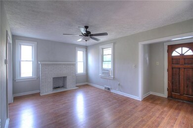 Living room with beautiful new floors and gas fire