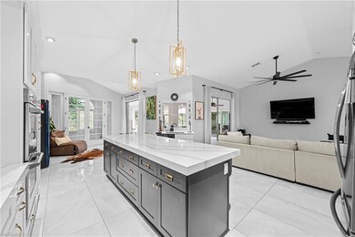 Kitchen with light stone counters, appliances with