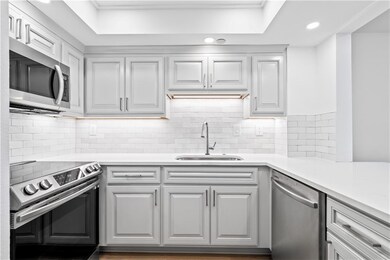 Well equipped kitchen with Stone Counter and SS Microwave/Range-Oven& Dishwasher