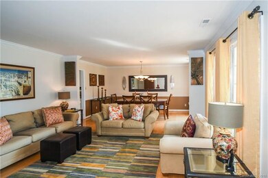 Living Room with hardwood floors, crown molding an