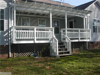 Exterior Back. Deck with arbor