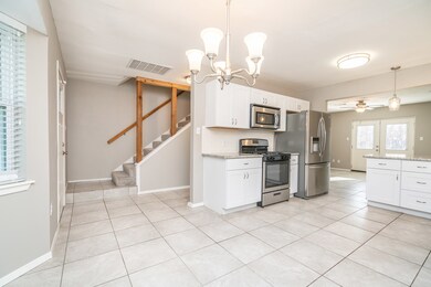 This view highlights the easy flow of the floorplan, with the front door flanked by the breakfast room on the right, staircase on the left, and the family room straight ahead. You'll enjoy privacy with the first floor master suite tucked away and secondary bedrooms upstairs.