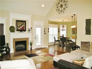 Gorgeous open floor plan with cozy fireplace helps to create a relaxing atmosphere. 