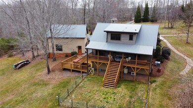 Deck overlooks the secluded backyard