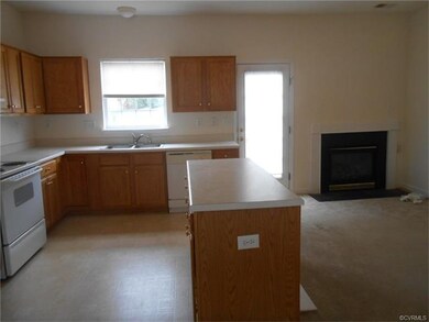 Kitchen with island/open to den with gas fireplace