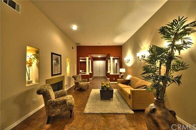 Formal living room with lighted art niches & a fir