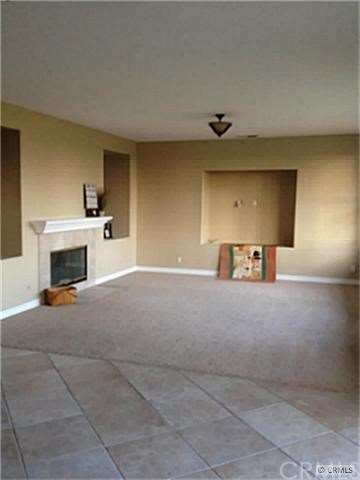 Family room with fire place and new carpet