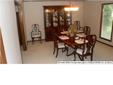 Looking into dining room from kitchen and breakfas