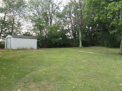 Exterior Front. Shed and level lot!