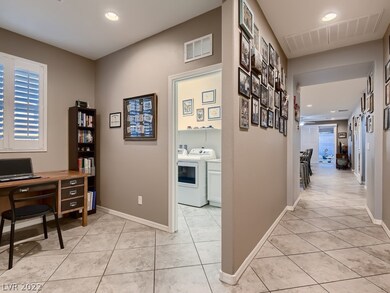 VIEW FROM FRONT DOOR SHOWS DEN/OFFICE SPACE TO THE