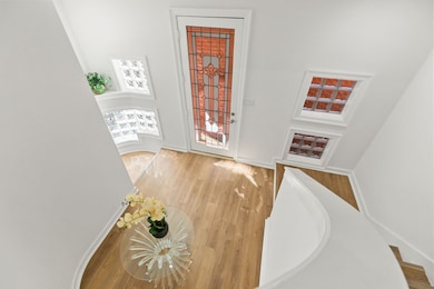 Great view from the top of the stairs on the second level to the foyer.