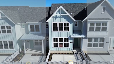 View of front facade with board and batten siding, a fenced front yard, a standing seam roof, and a shingled roof (pictures are of a previous home built)