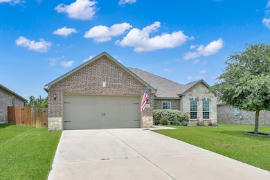 Charming single-story brick house with a two-car g