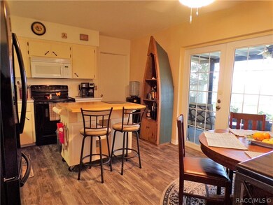 Eat in kitchen. French doors to the screen porch.