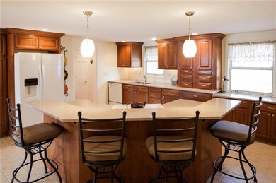 The spacious eat-in kitchen has...