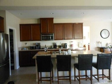 Rich Dark Maple Cabinets Compliment The Decor!