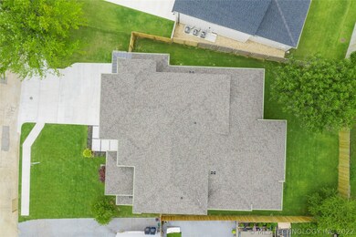 The professionally landscaped lawn is completed wi