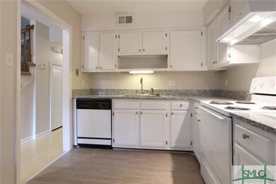 Kitchen to the right of entry way.