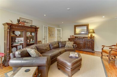 Den with view into entry hall.