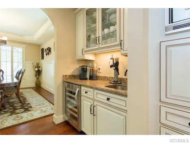 Butler's pantry, wine fridge and wet bar connect k