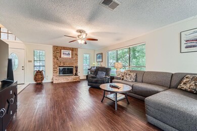 Living area with dark wood-type flooring, ceiling
