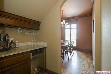 Butler's Pantry with a wine fridge, and storage fo