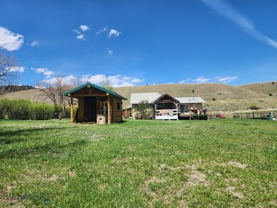 REAR OF HOME WITH CABIN