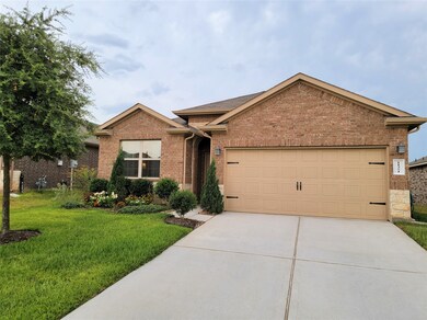 2-car garage and driveway located near bank of mailboxes.