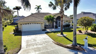 View of front of home featuring a front yard and a garage