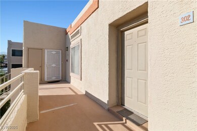 Entrance to property featuring stucco siding and a