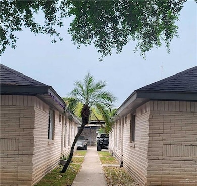 View of property exterior featuring brick siding