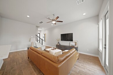 This spacious living room with neutral paint color