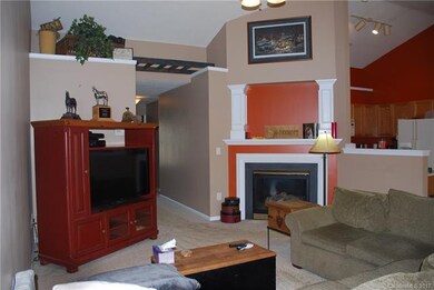 Great room with vaulted ceiling and gas fireplace.