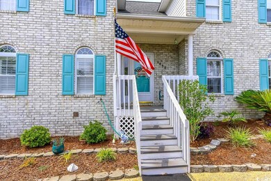 Entrance to property featuring brick siding